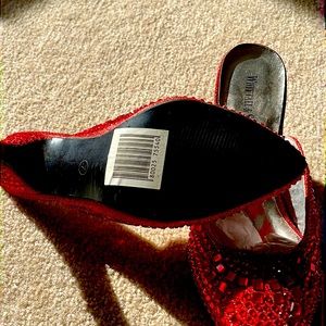 It’s a beautiful red slide on sequence shoe